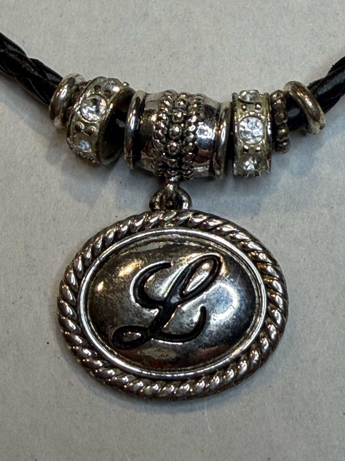 Napier silver-tone initial L with charms bundled with two extra boho necklaces.