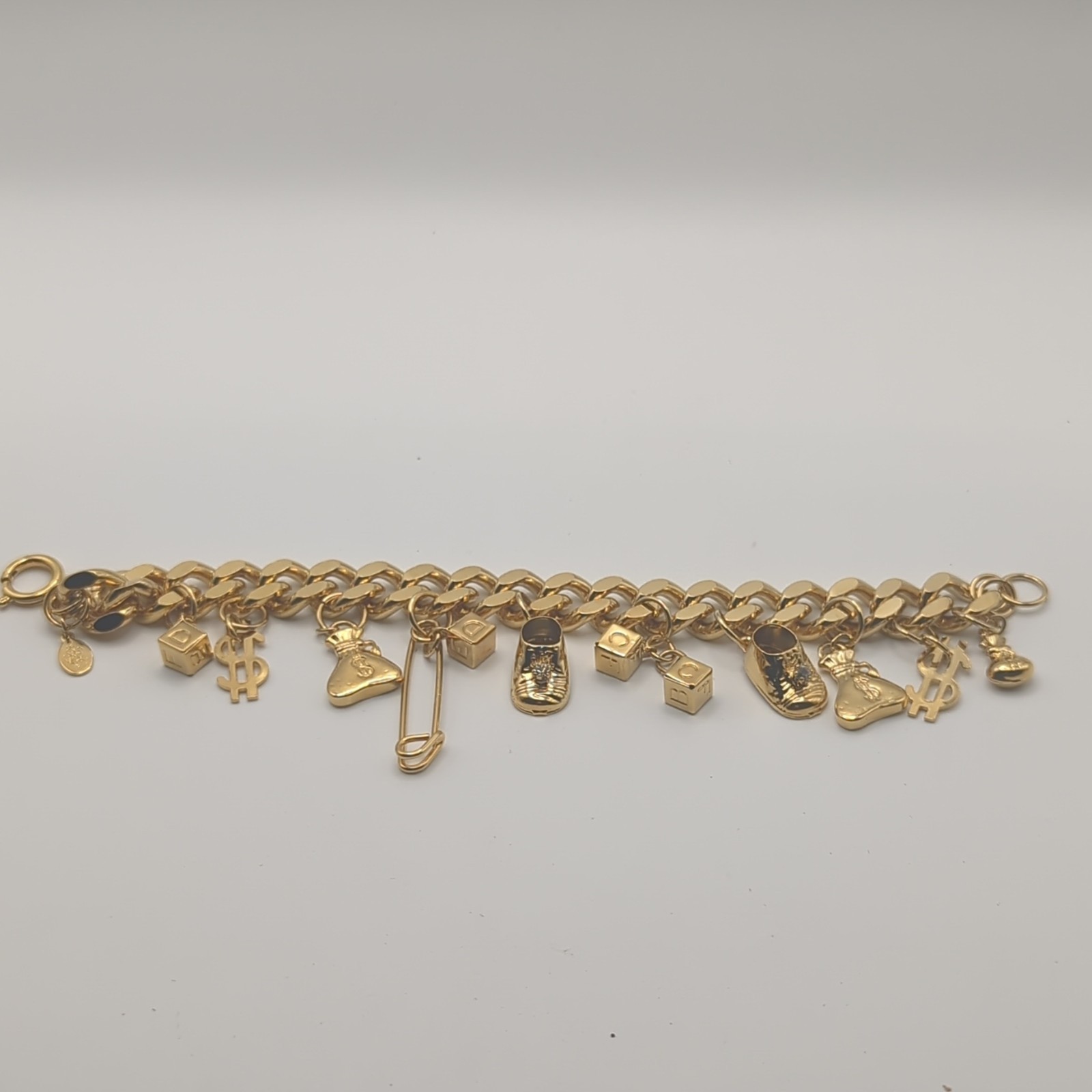 Kirks Folly Gold Tone Chain Dangle Charm Bracelet, Money Theme, Spring Ring