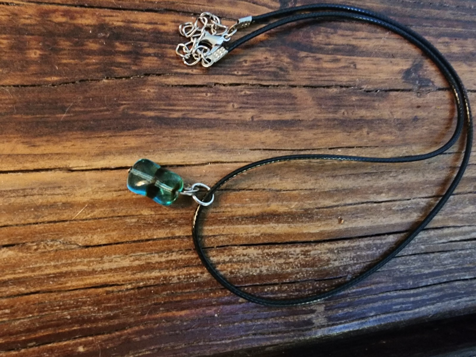 Handmade Black Corded Necklace with Clear Blue Glass Bead and black stripe