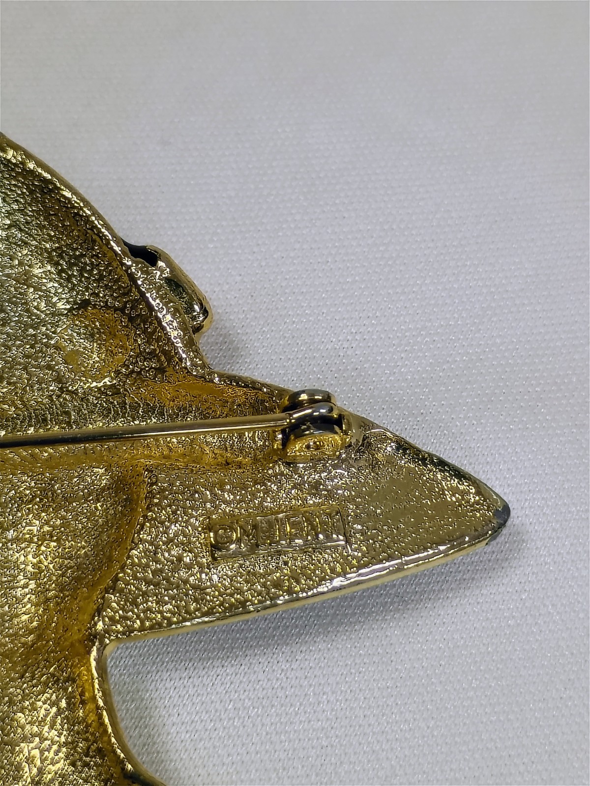 Vintage M J ENT gold-tone and black enamel lady hat brooch