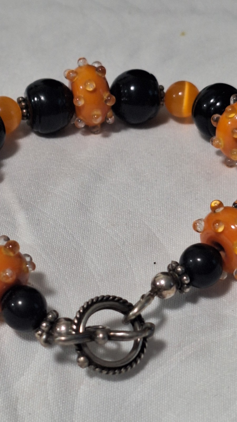 Black/Orange Glass Beaded Bracelet, Silver Tone Toggle Clasp, Dangle Charm