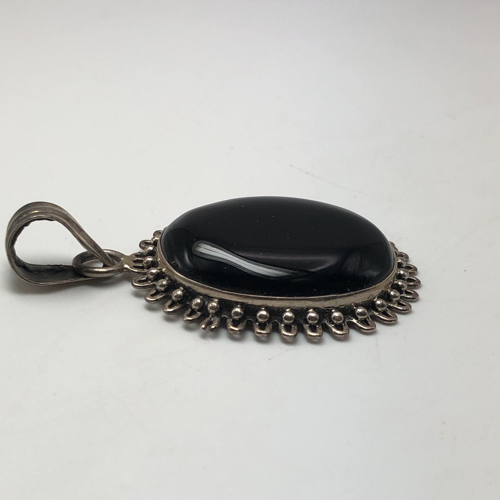 Black Onxy Oval Cabochon Pendant Bezel Set In Sterling Silver