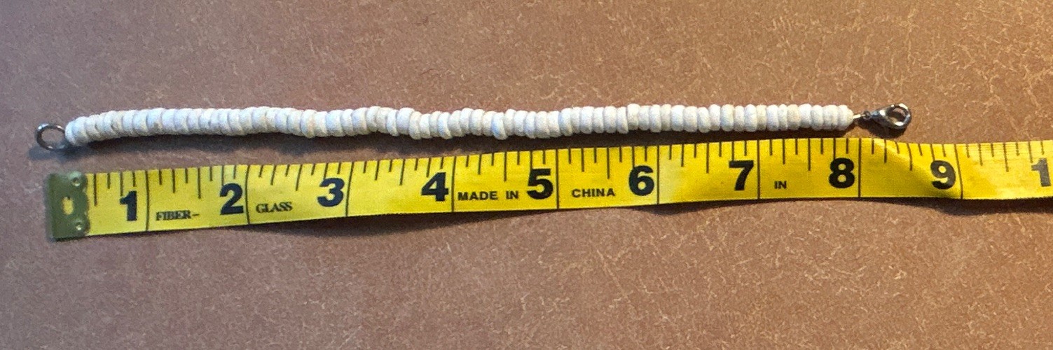 Vintage white puka shell heishe bead, lobster clasp. Length 8 1/2”
