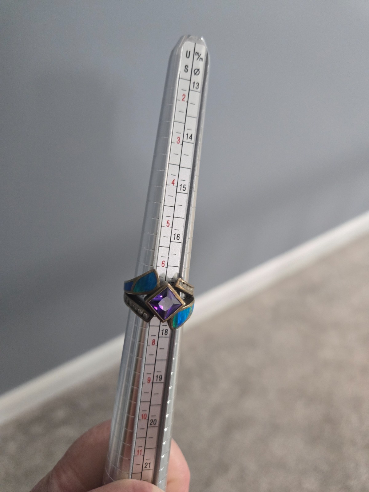 Iridescent blue-green and purple gem statement ring