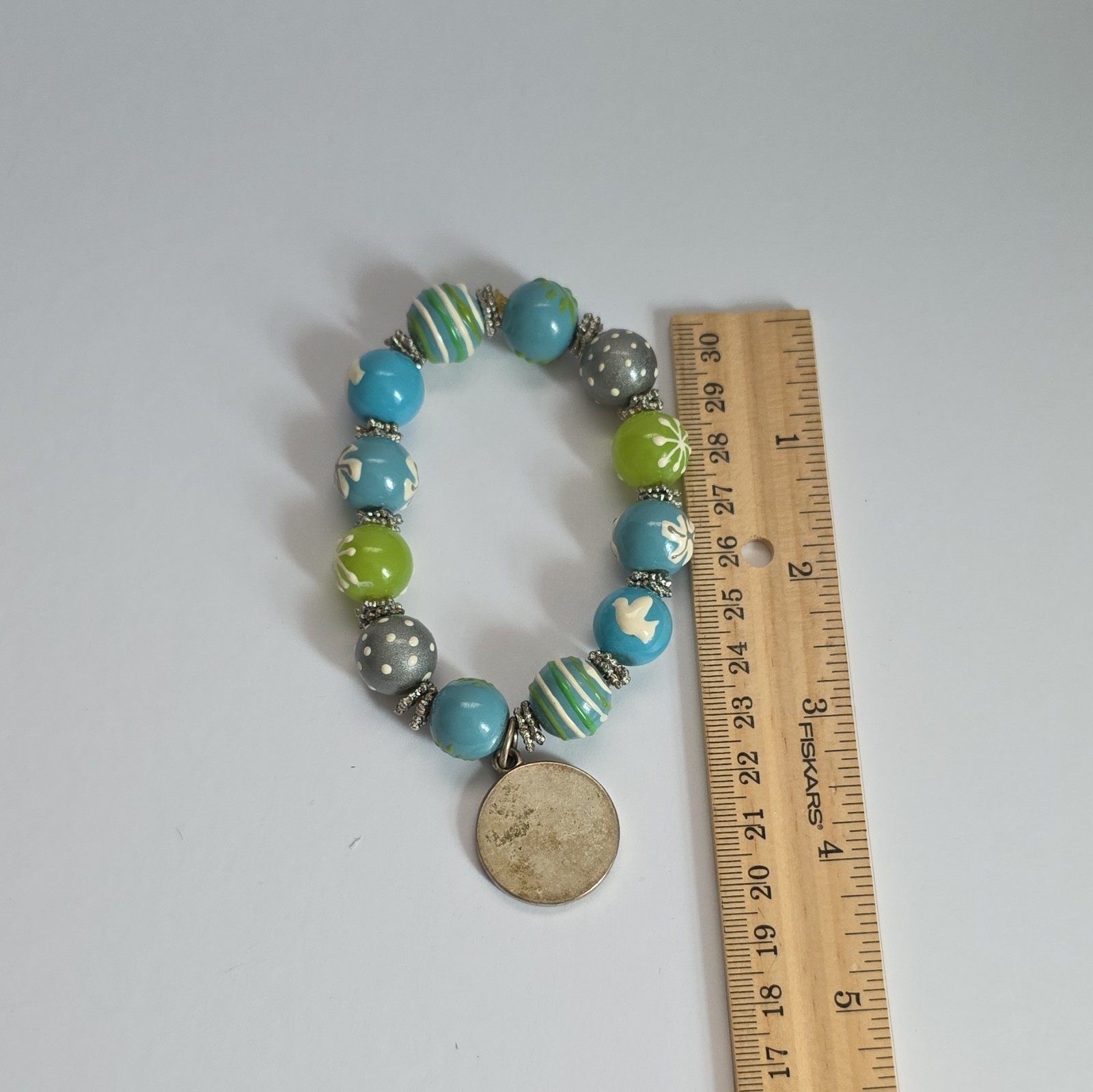 Vintage Angela Moore hand-painted beaded bracelet features blue, green, & gray