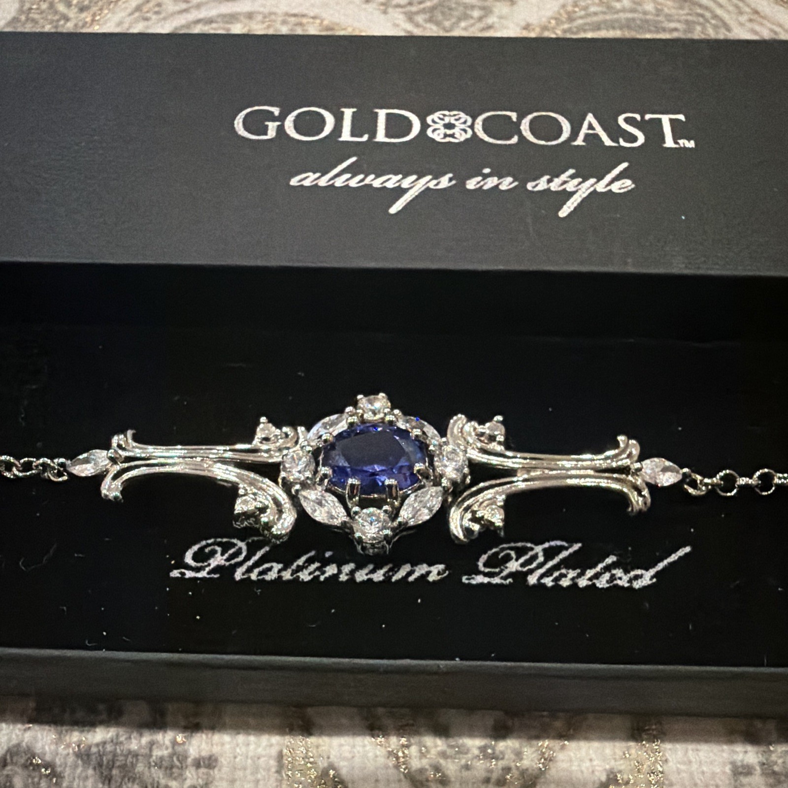Gold Coast Platinum Plated Silver Cable Chain Bracelet w/ Blue Round Stone