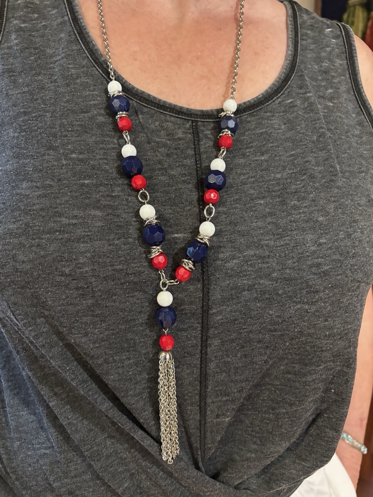 Blue, Black, Gold, Red, and White beaded necklace With Tassel