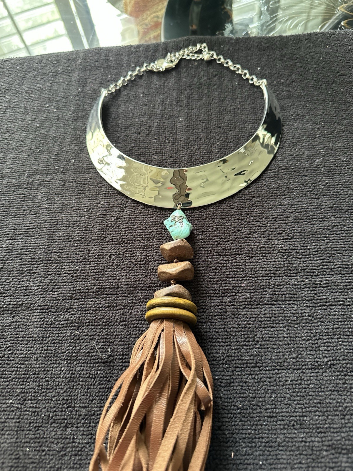 Chico’s boutique necklace; turquoise stone, metal with leather fringes;