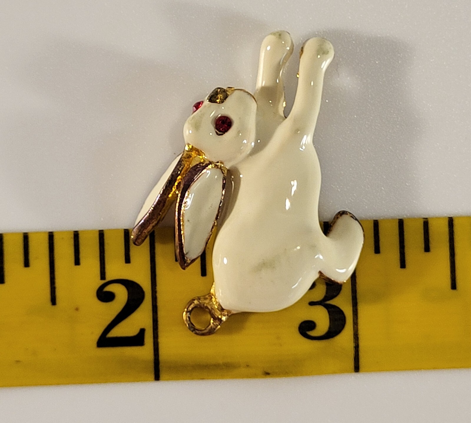 Enameled White Bunny Charm Made With Unknown Base Metal In Gold Color Red Eyes