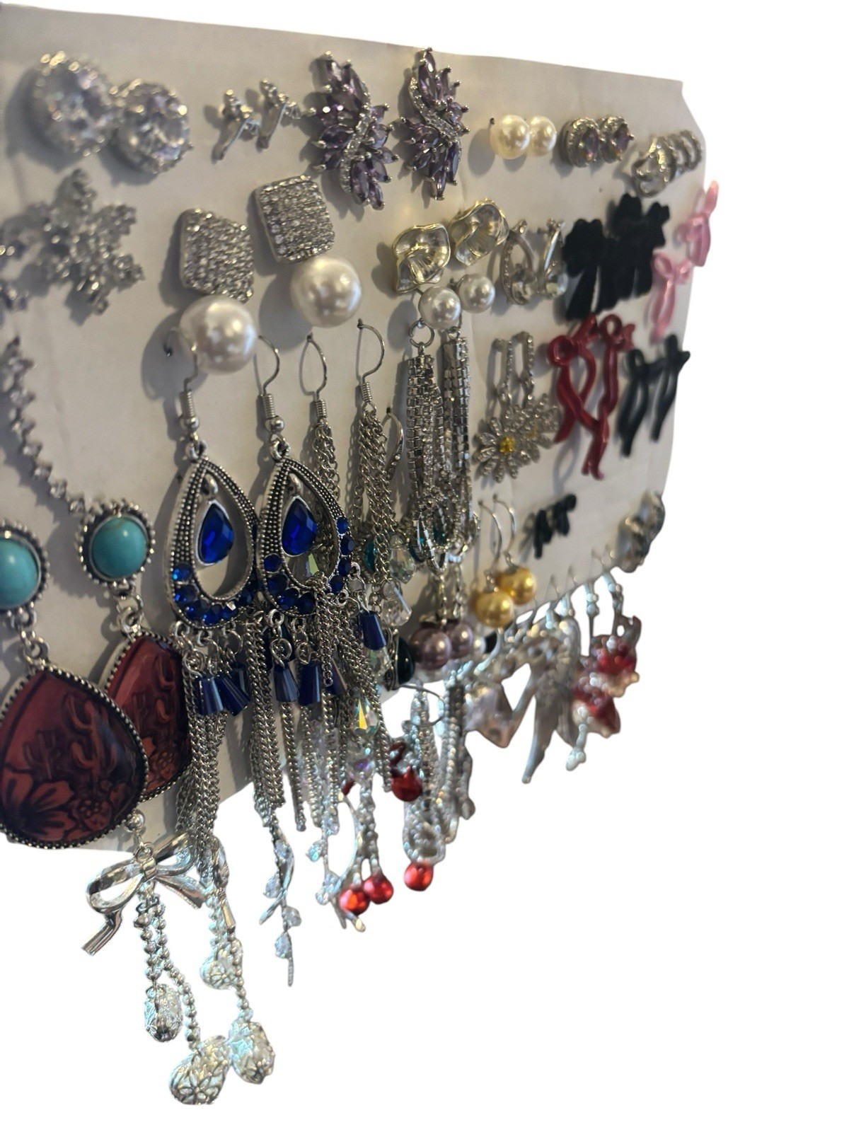 Over 60 pair of Silvertone earrings new