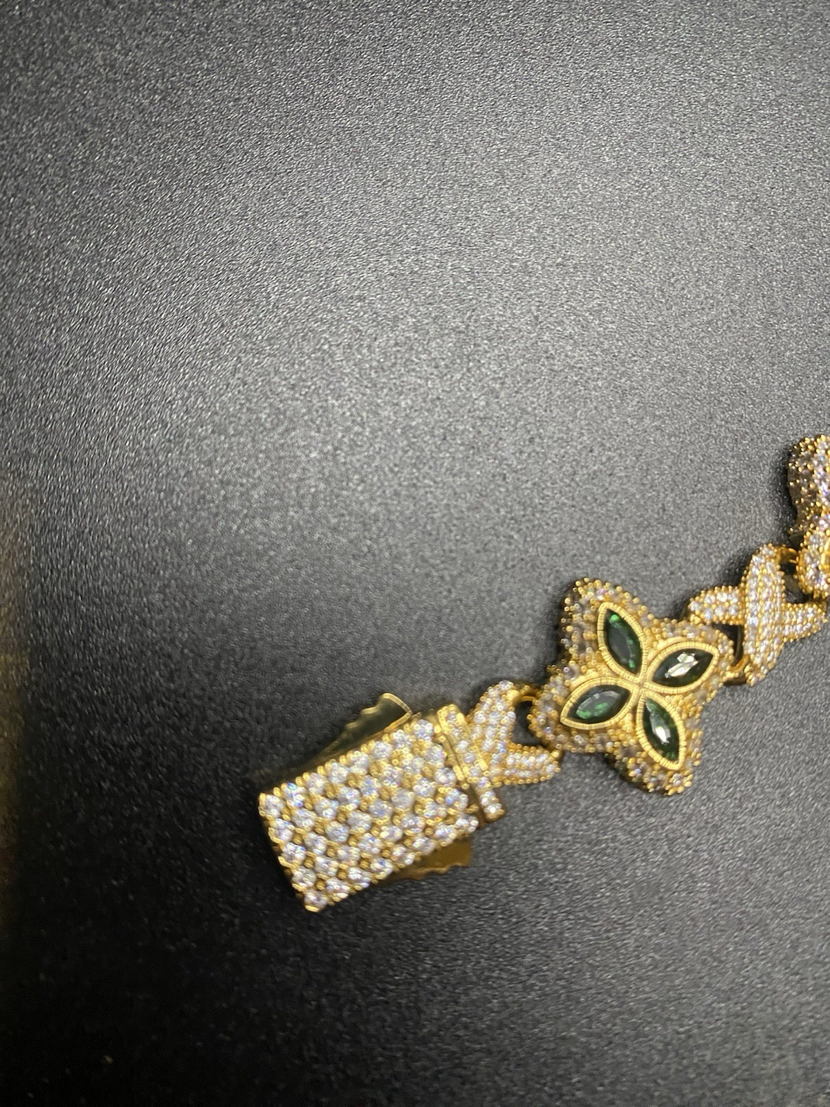 8in 15mm 10k gold plated clover bracelet with emerald clovers.