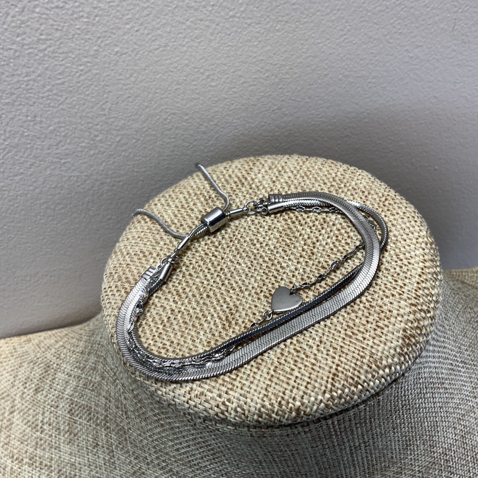 Modern adjustable layered herringbone chain heart bracelet in silver tone