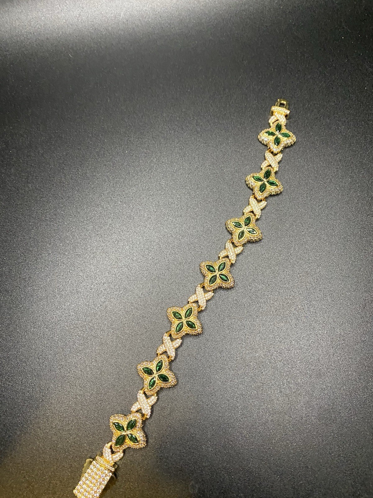 8in 15mm 10k gold plated clover bracelet with emerald clovers.