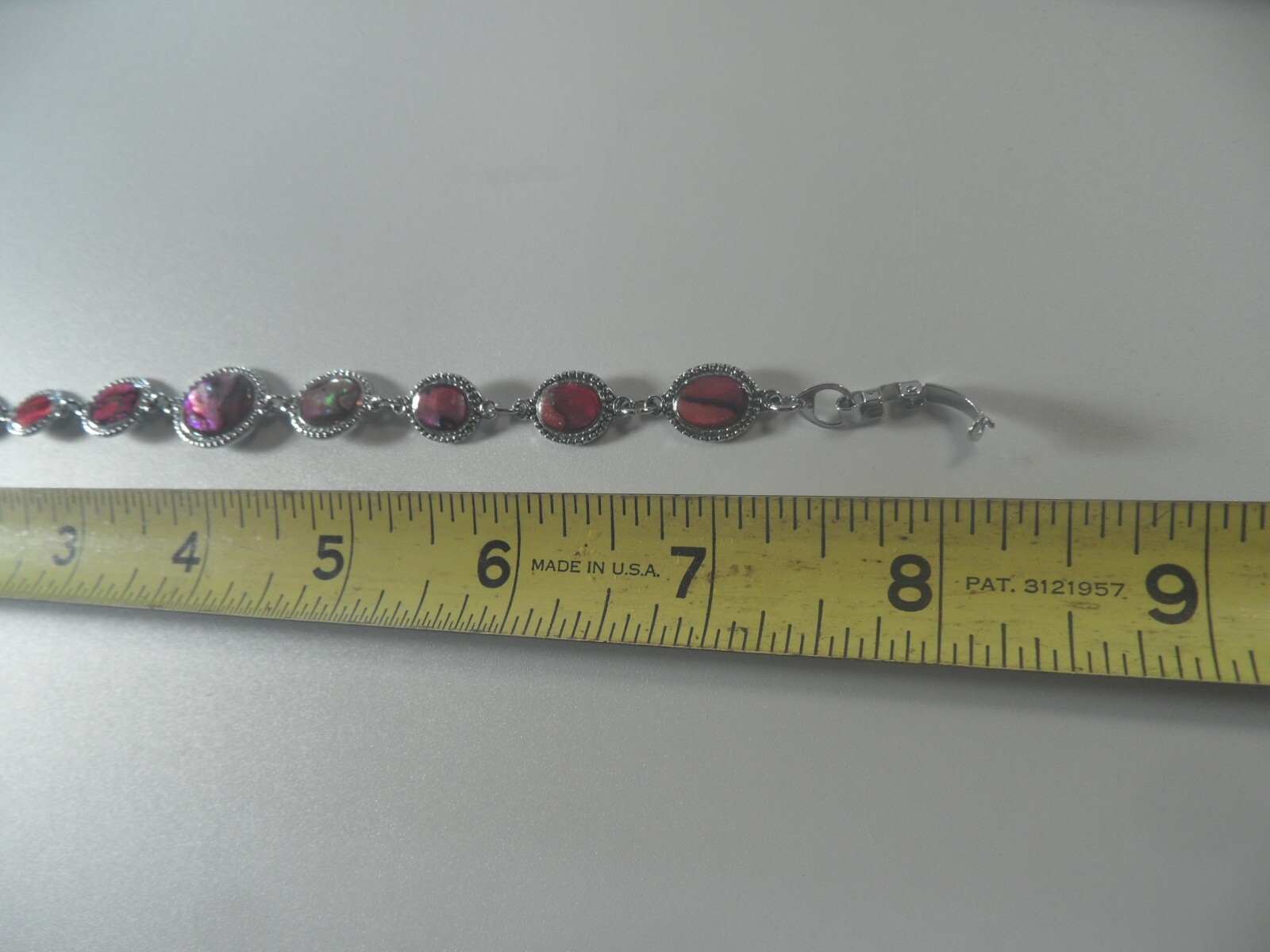 D2- 47 costume jewelry 7″ bracelet silvertone with faux abalone design