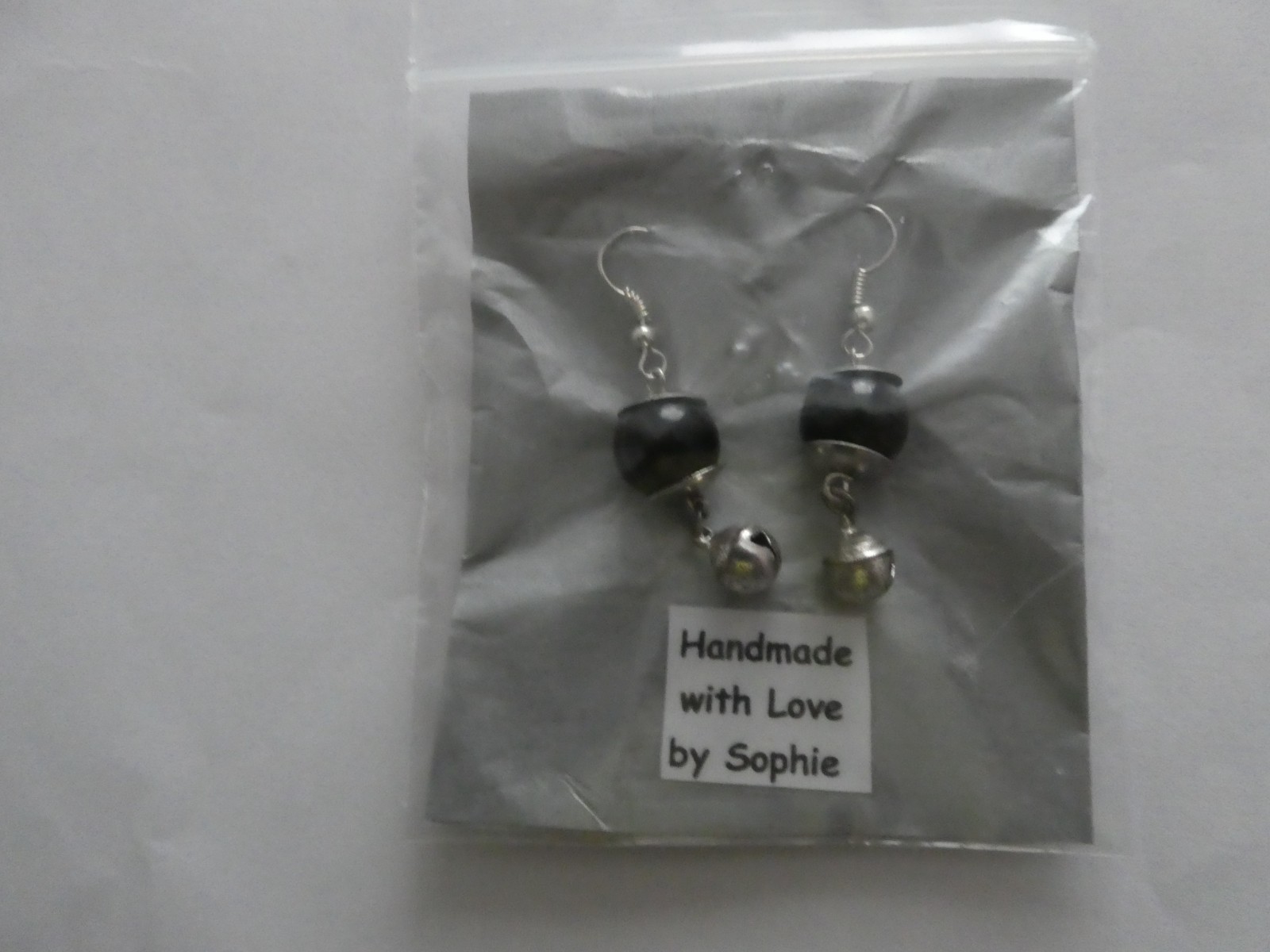 Handmade black bead and sliver bell sliver-plated earrings