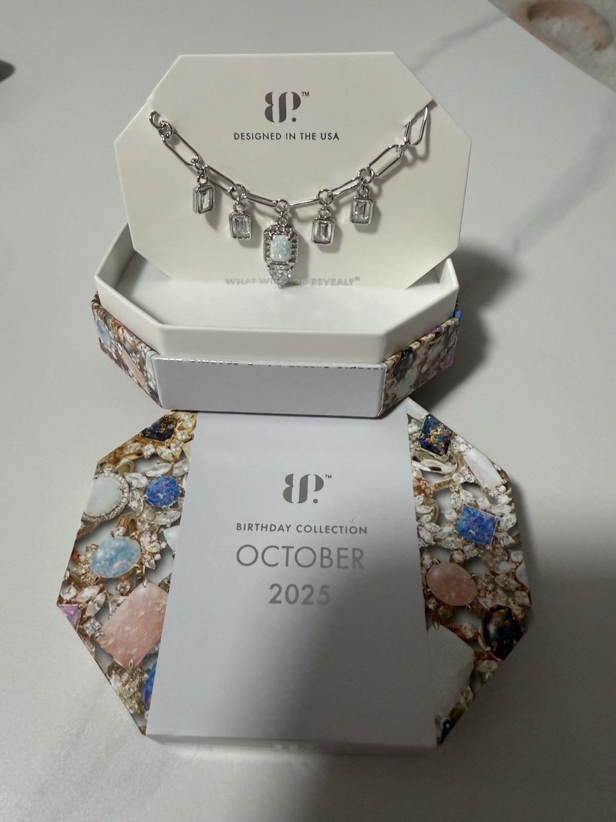 Bomb Party October Birthday necklace. Rhodium plated. Milky white opal.