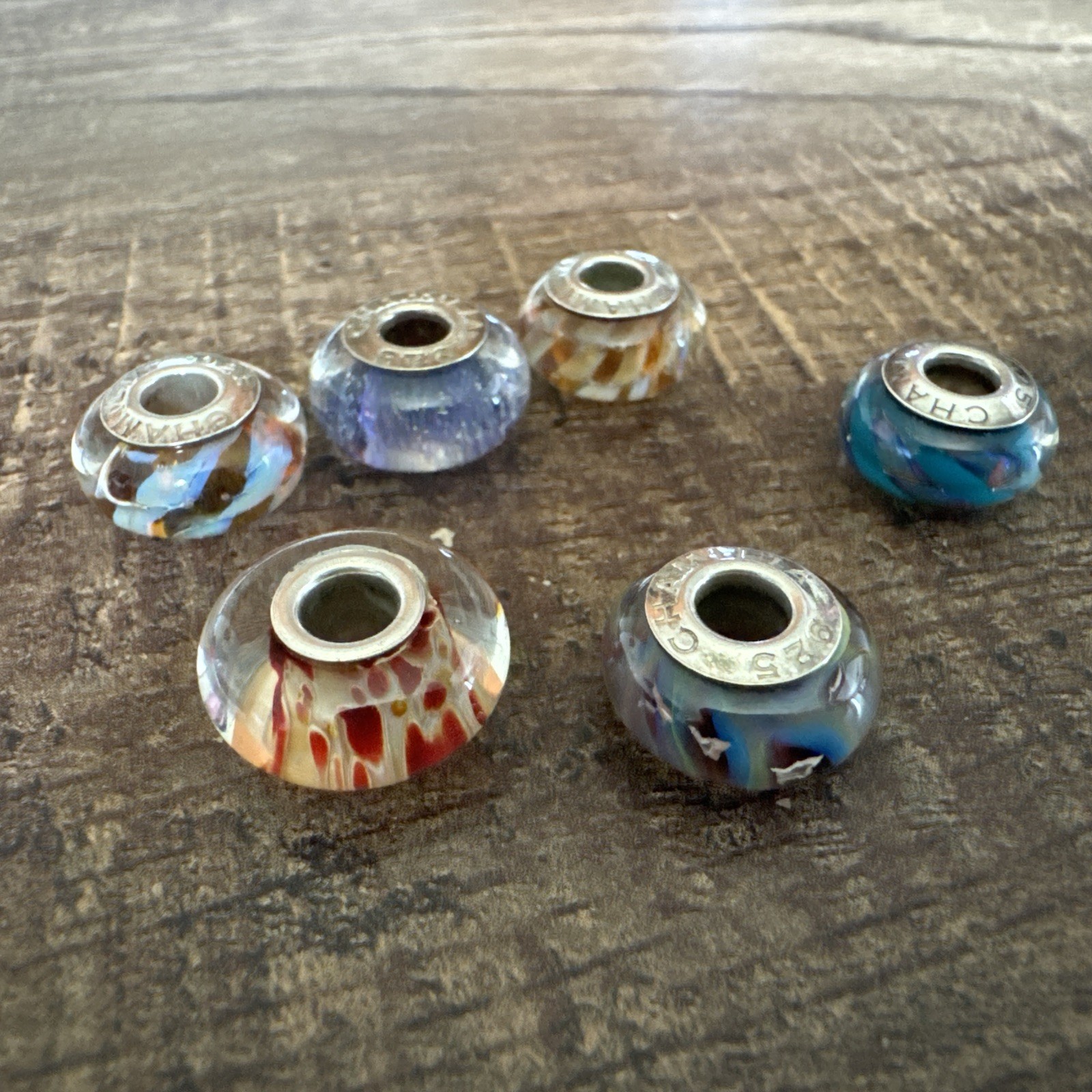 New without tags, Chamilia 7 pieces glass Murano charm lot