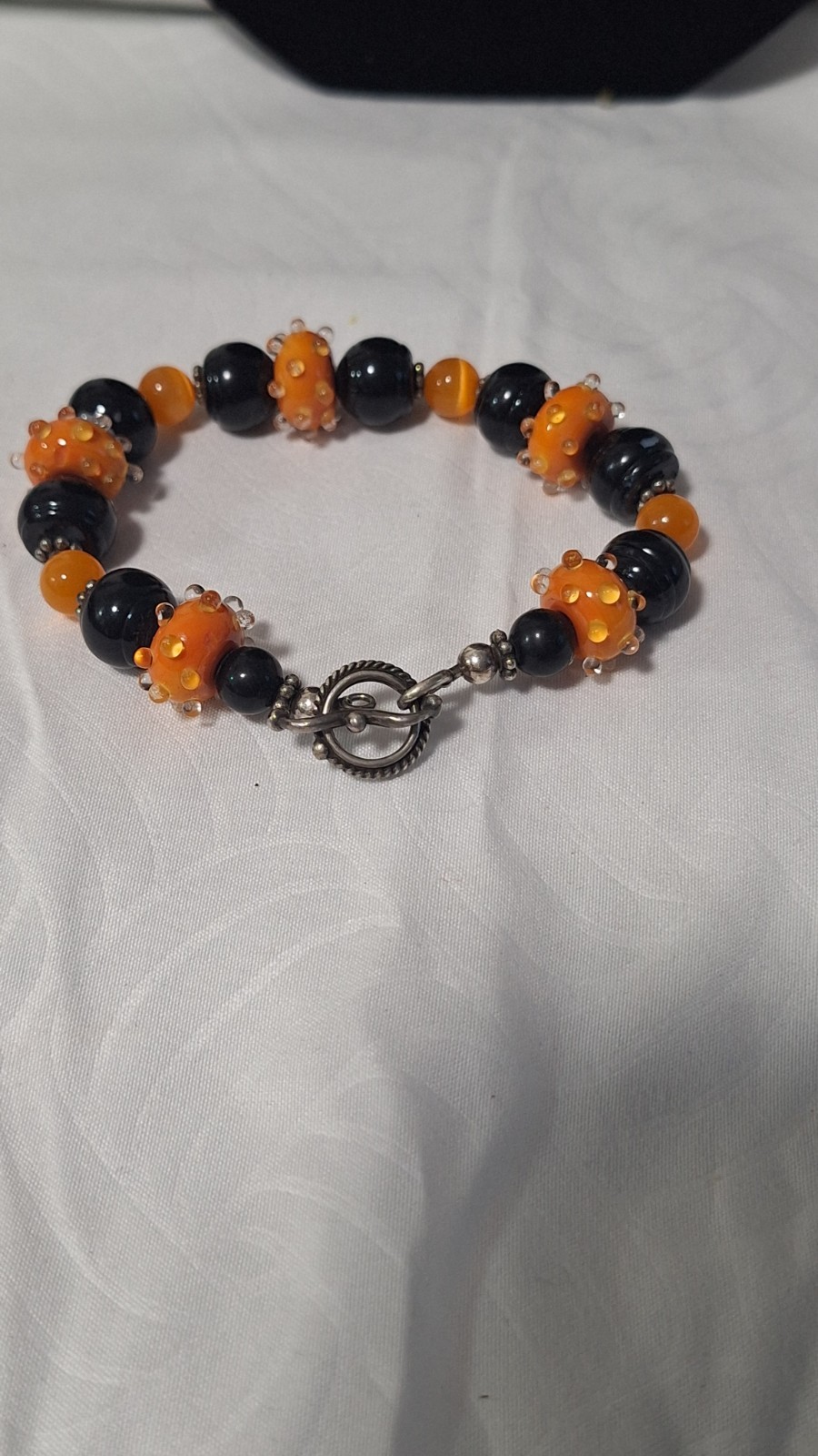 Black/Orange Glass Beaded Bracelet, Silver Tone Toggle Clasp, Dangle Charm
