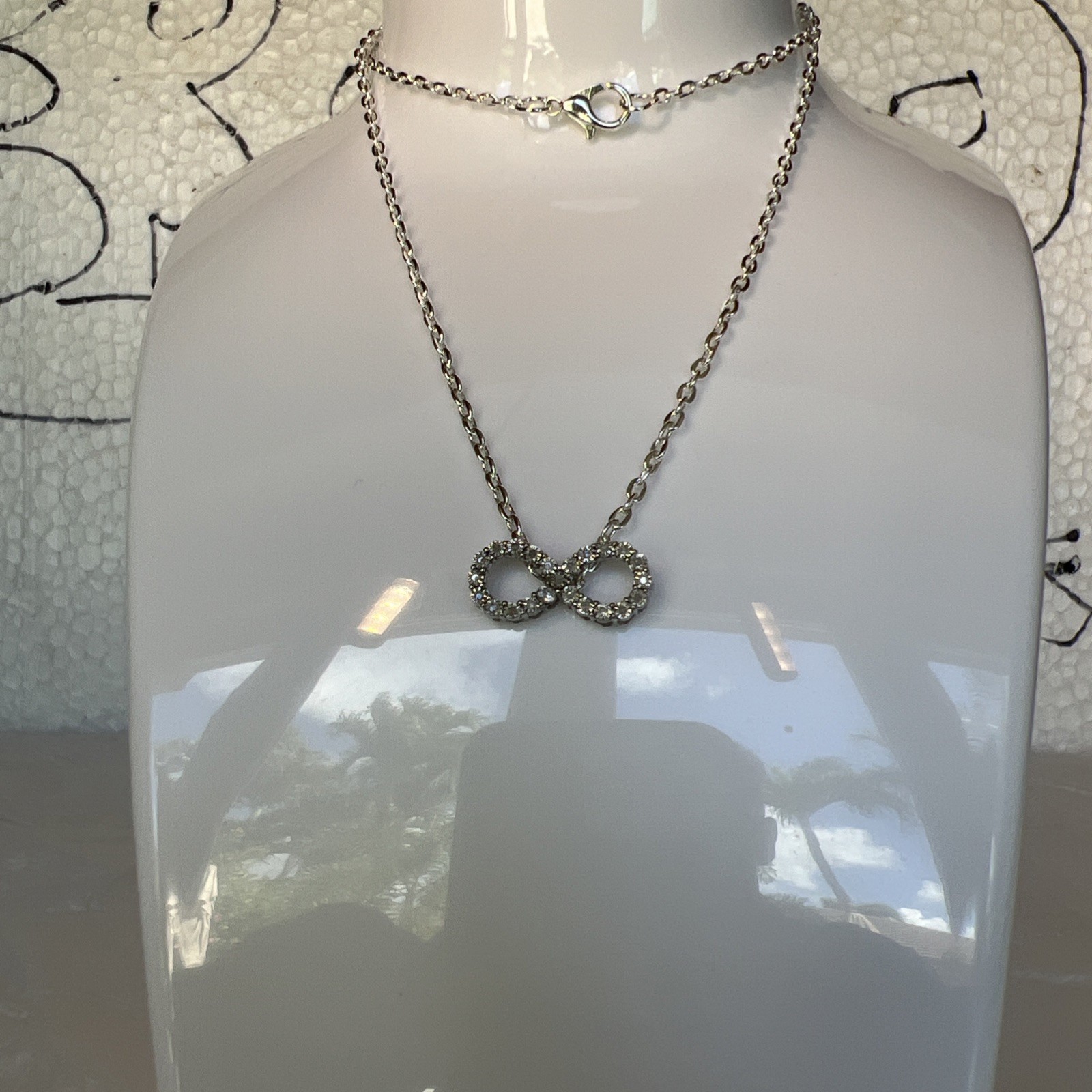 Brilliant Infinity Necklace With silver Chain, new without tags, see photos