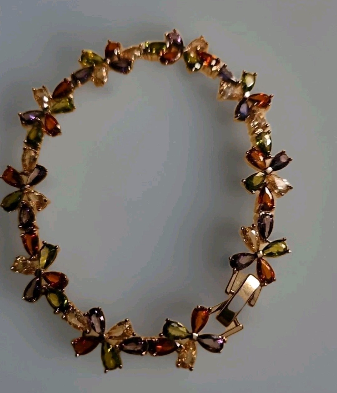 Beautiful 6.5 Inch Multicolor Gemmed Four Leaf/Butterfly Design Bracelet