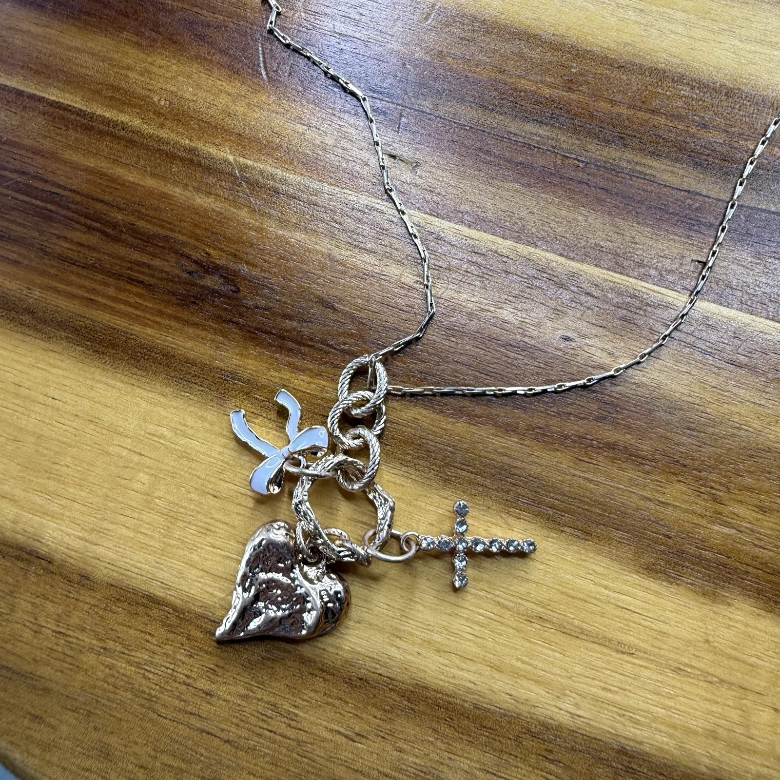 BKE Gold Tone Multi Charm Pendant Necklace Heart Cross Bow 15” + 3” Extender