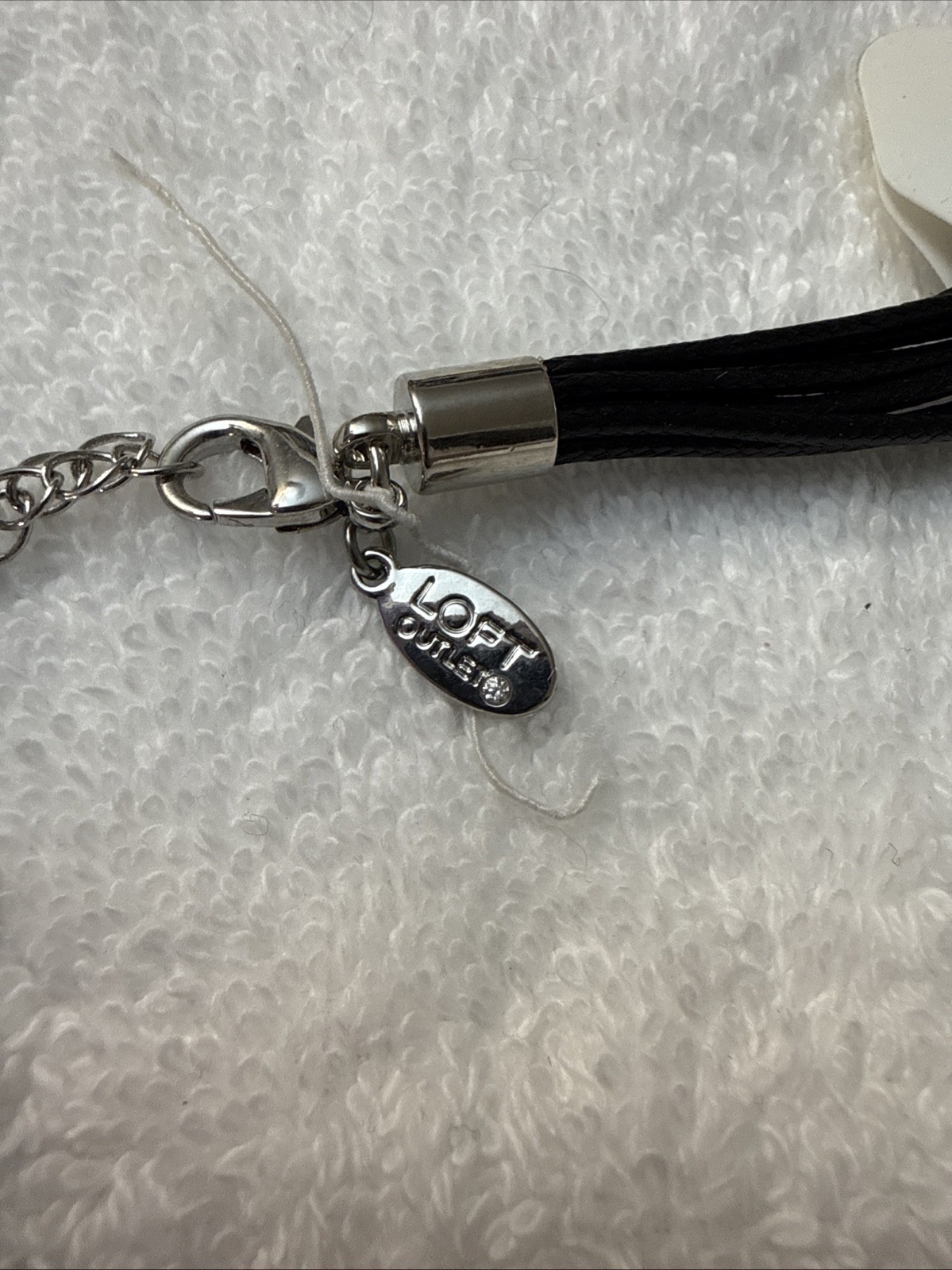 Loft Outlet Necklace. Black rolled, Silver accents, Yellow Tassles
