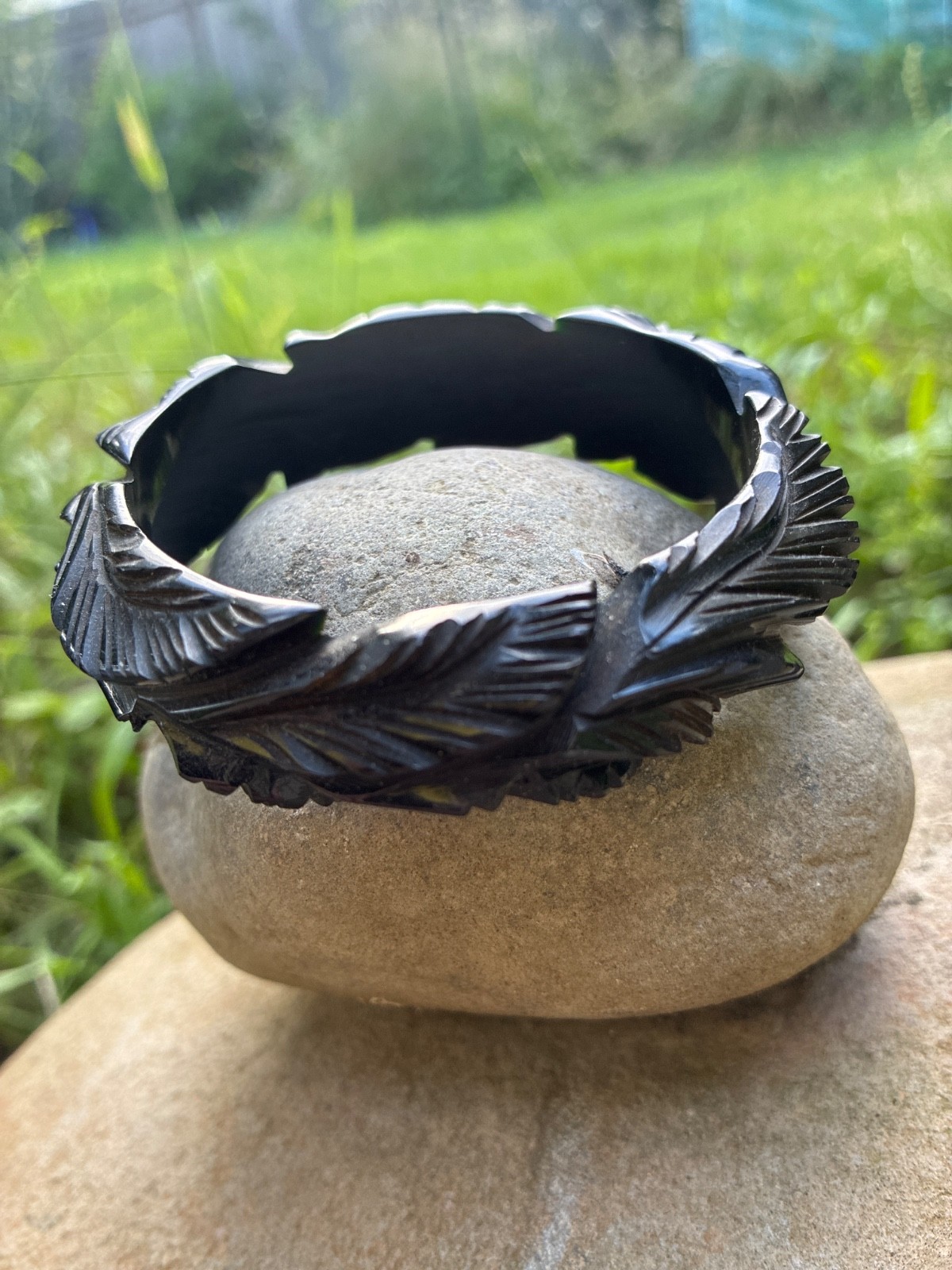 Mid century vintage black Bakelite bangle with leaf pattern