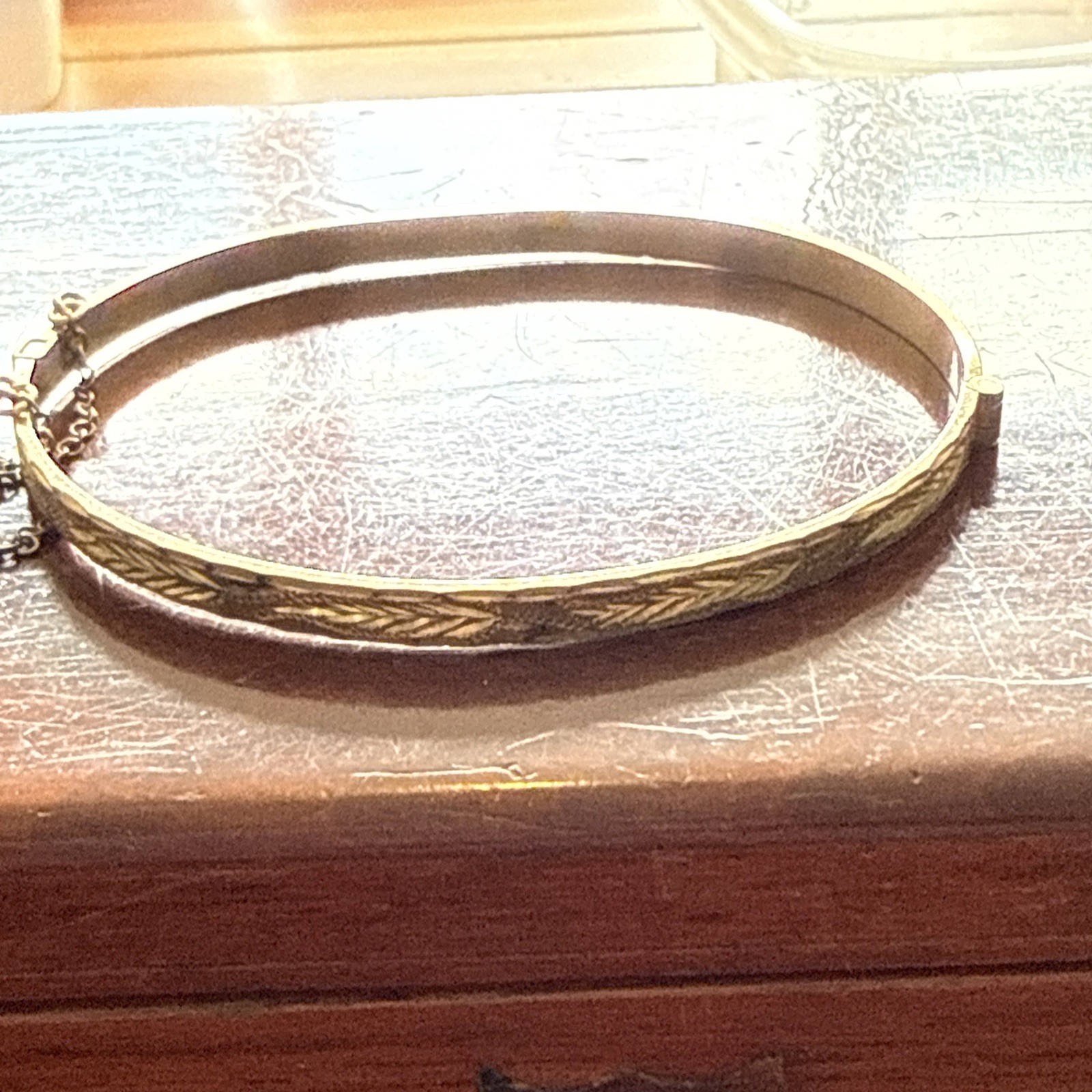 B Ltd 9ct 50 Micron Rolled Gold hinged engraved bangle with safety chain