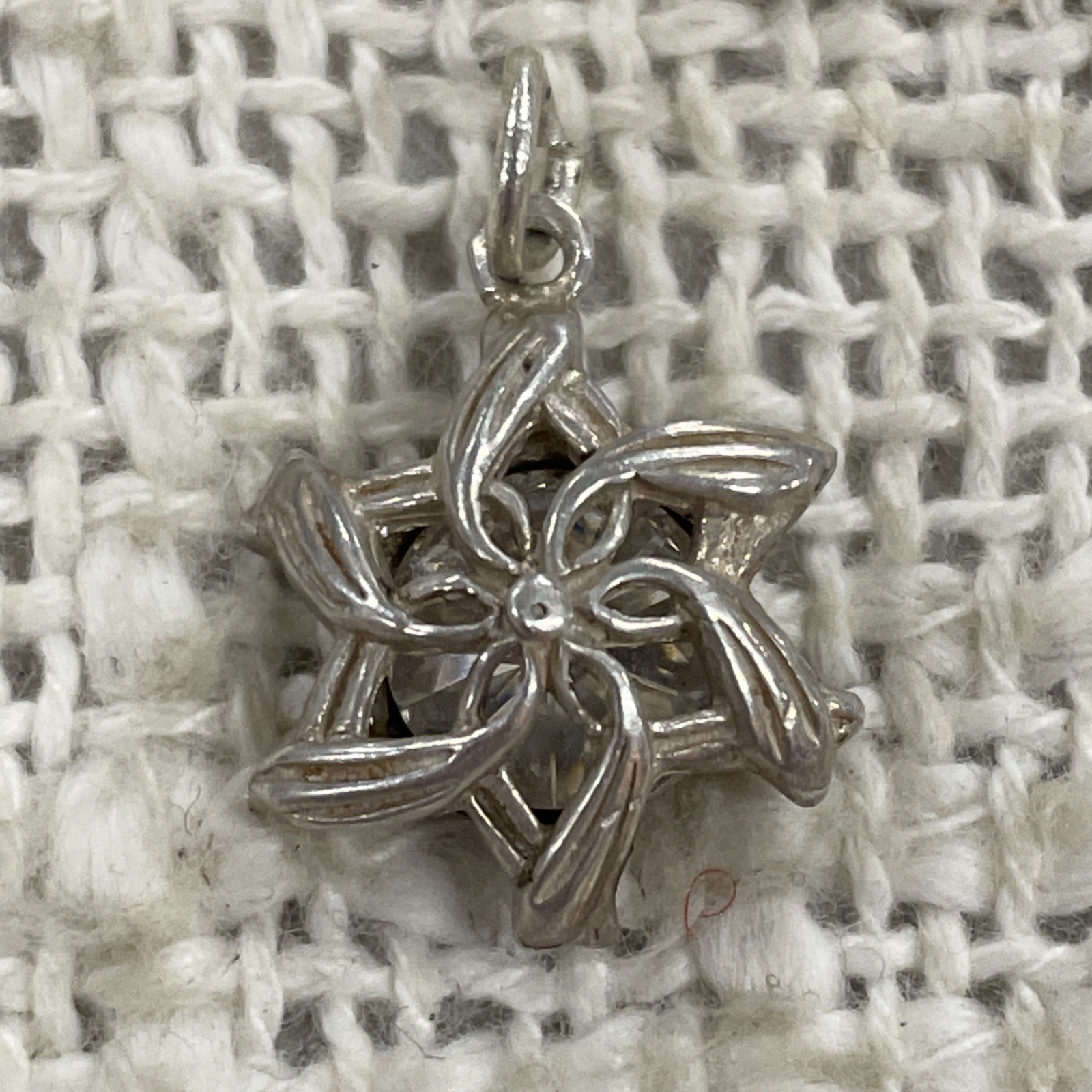 Silver Toned Clear White Gem Enclosed Floral Charm Pendant