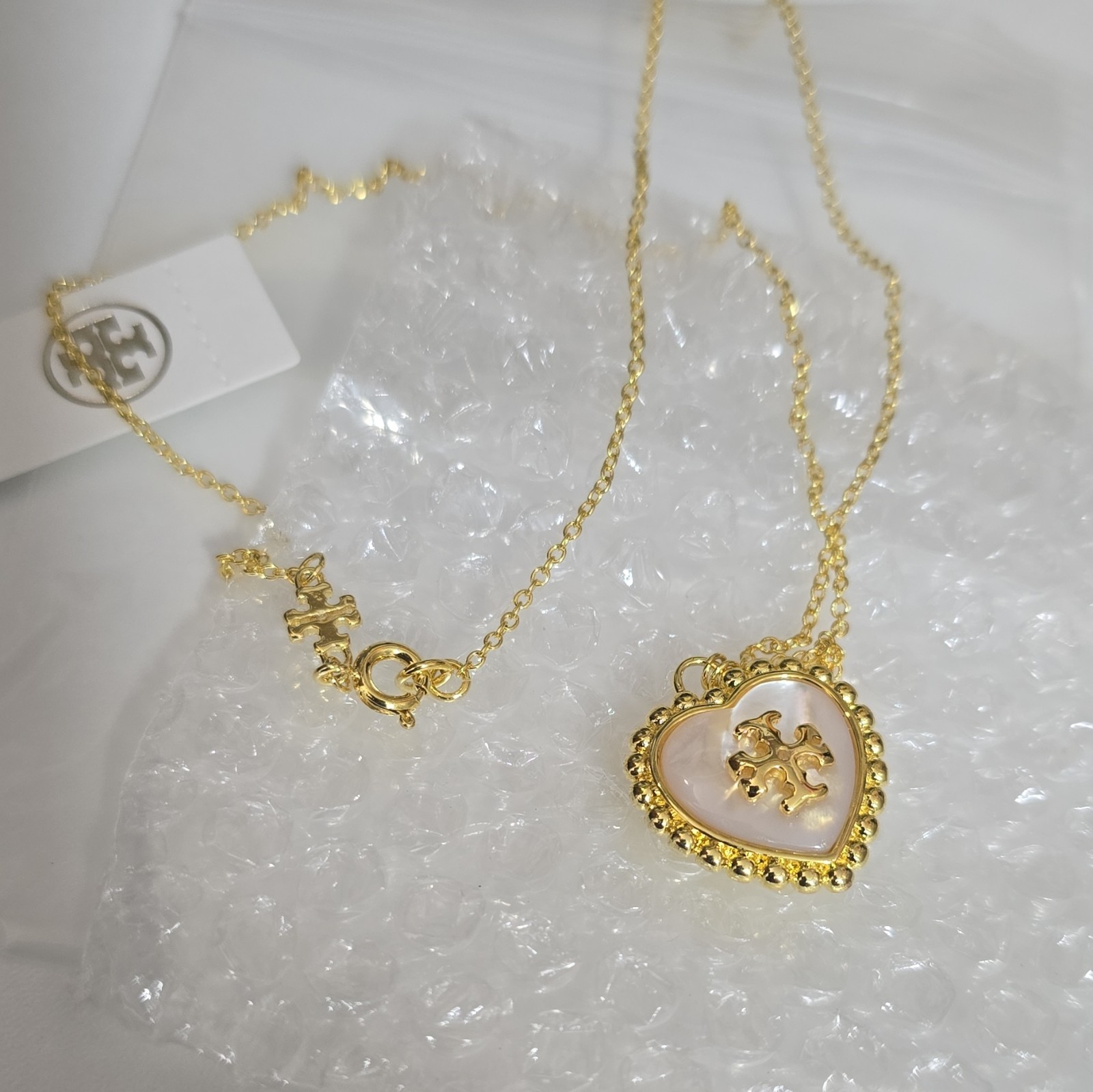 Tory Burch Gold Tone Mother of Pearl Heart Charm Pendant Necklace Cable Lobster