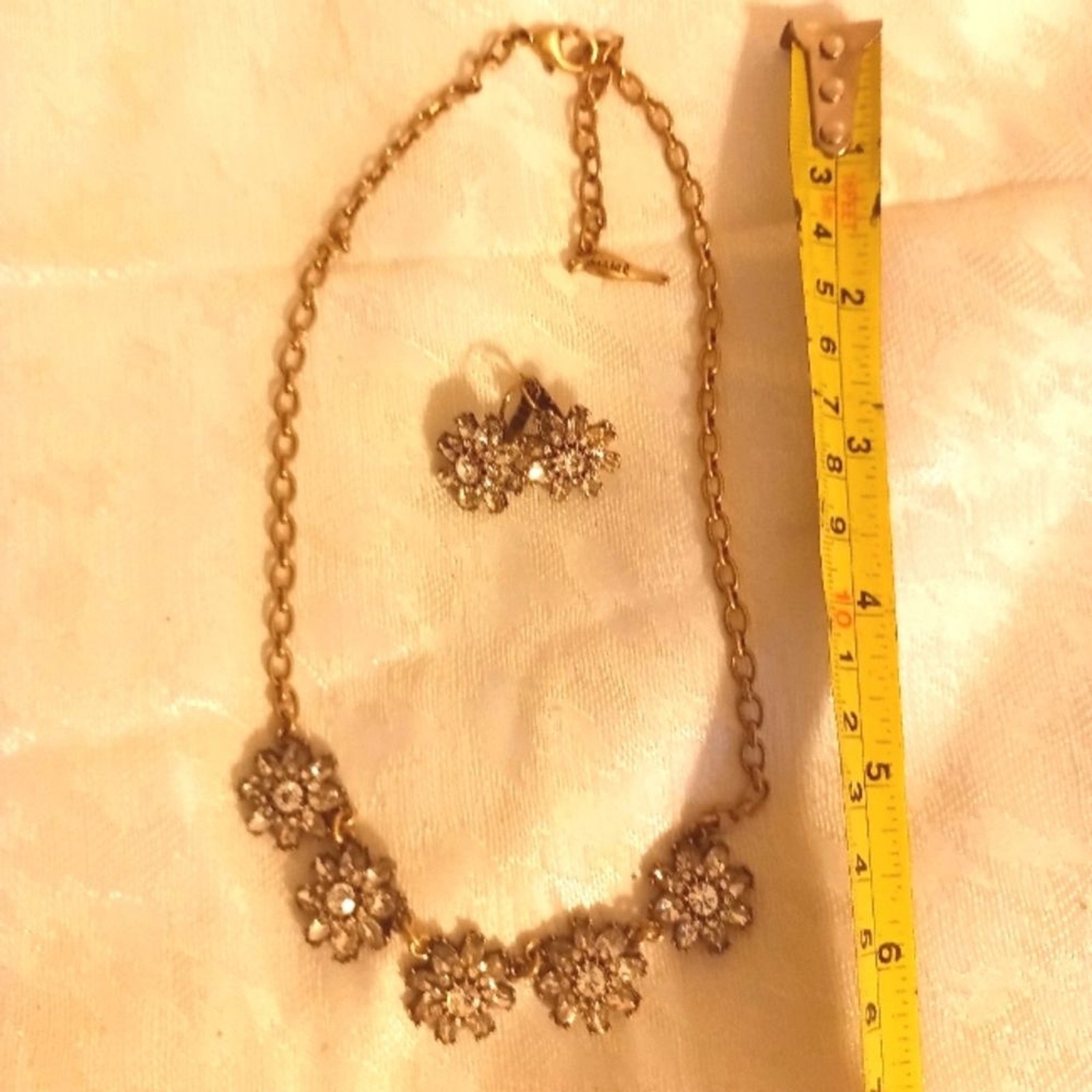 Chloe+Isabel flower rhinestone necklace and earring set. Antique gold
