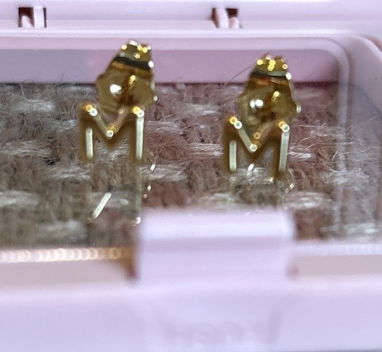 Mumreues Gold “M” Stud Earrings.
