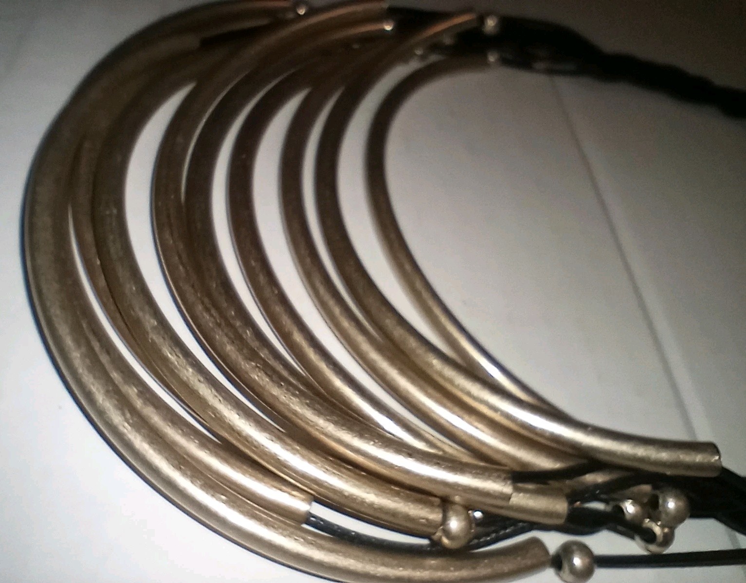 Necklace Contemporary Gold Tone Vinyl Or Leather Gold Tone Hollow Tubes.