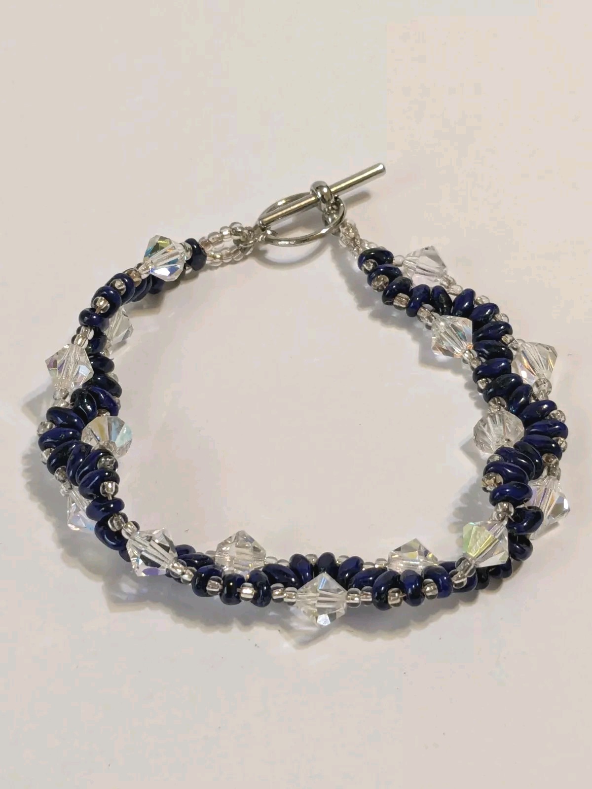 Silver Tone, Blue & Clear Faceted Acrylic Beads Woven Toggle Bracelet. 6 3/4″.