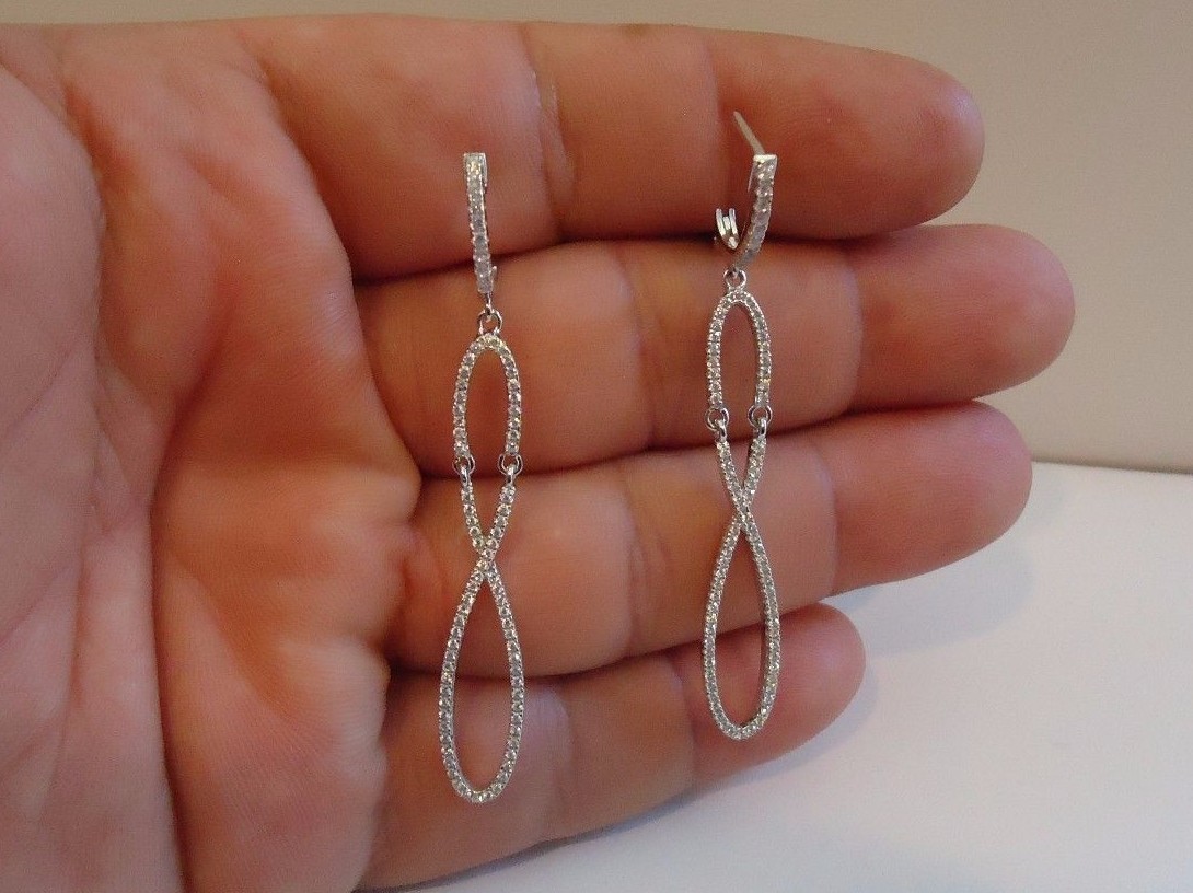 925 STERLING SILVER LADIES DANGLING FIGURE 8 EARRINGS W/ LAB CREATED DIAMONDS