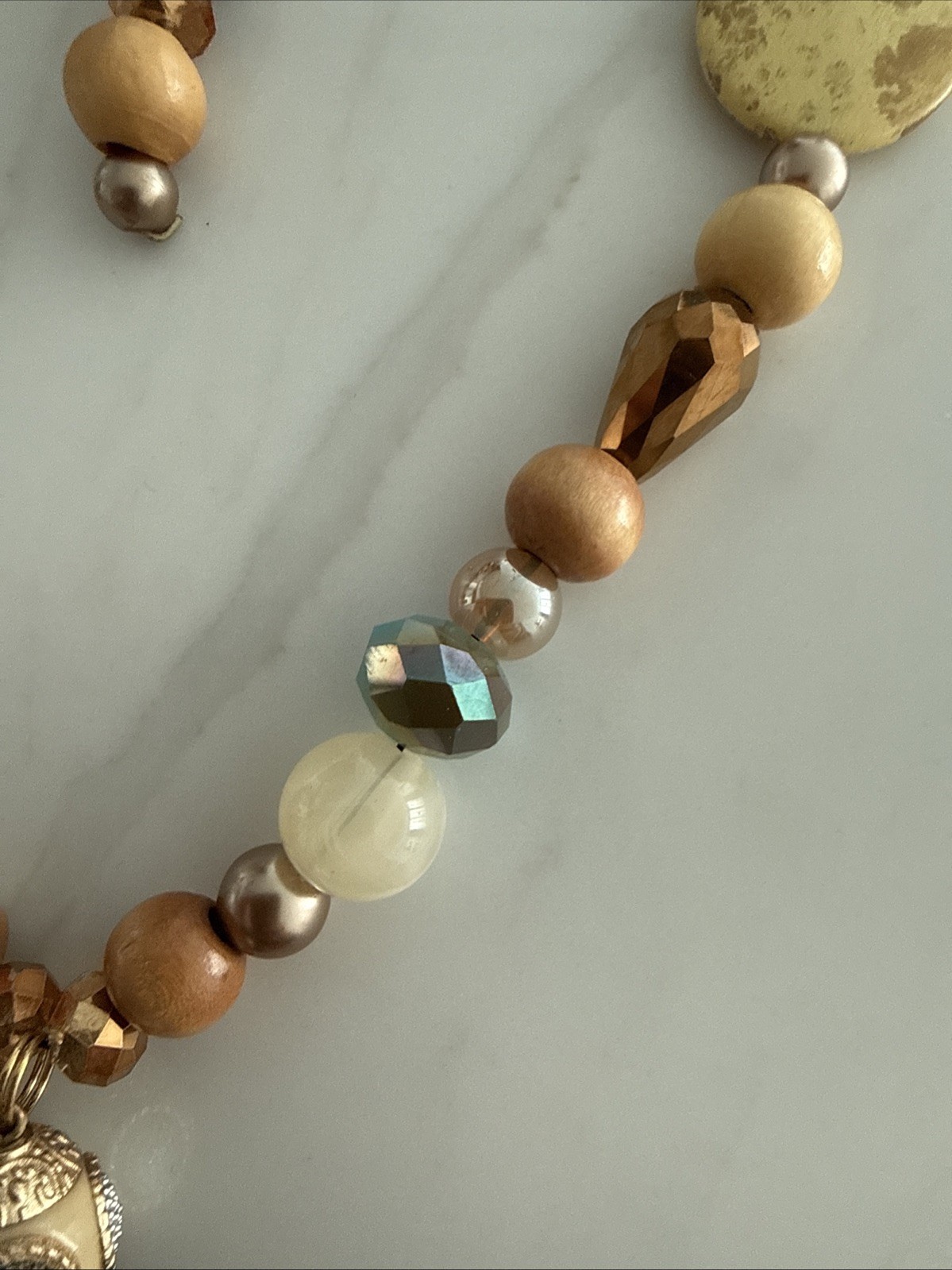 This bohemian-style jewelry a multi-textured beaded necklace & matching earrings
