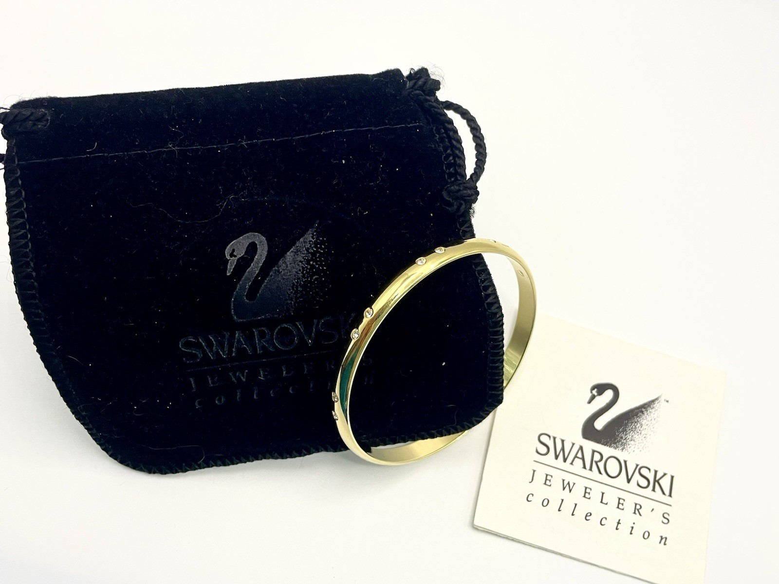 Swarovski Gold Tone Bangle Bracelet with Scattered Crystal Accents Swan Logo