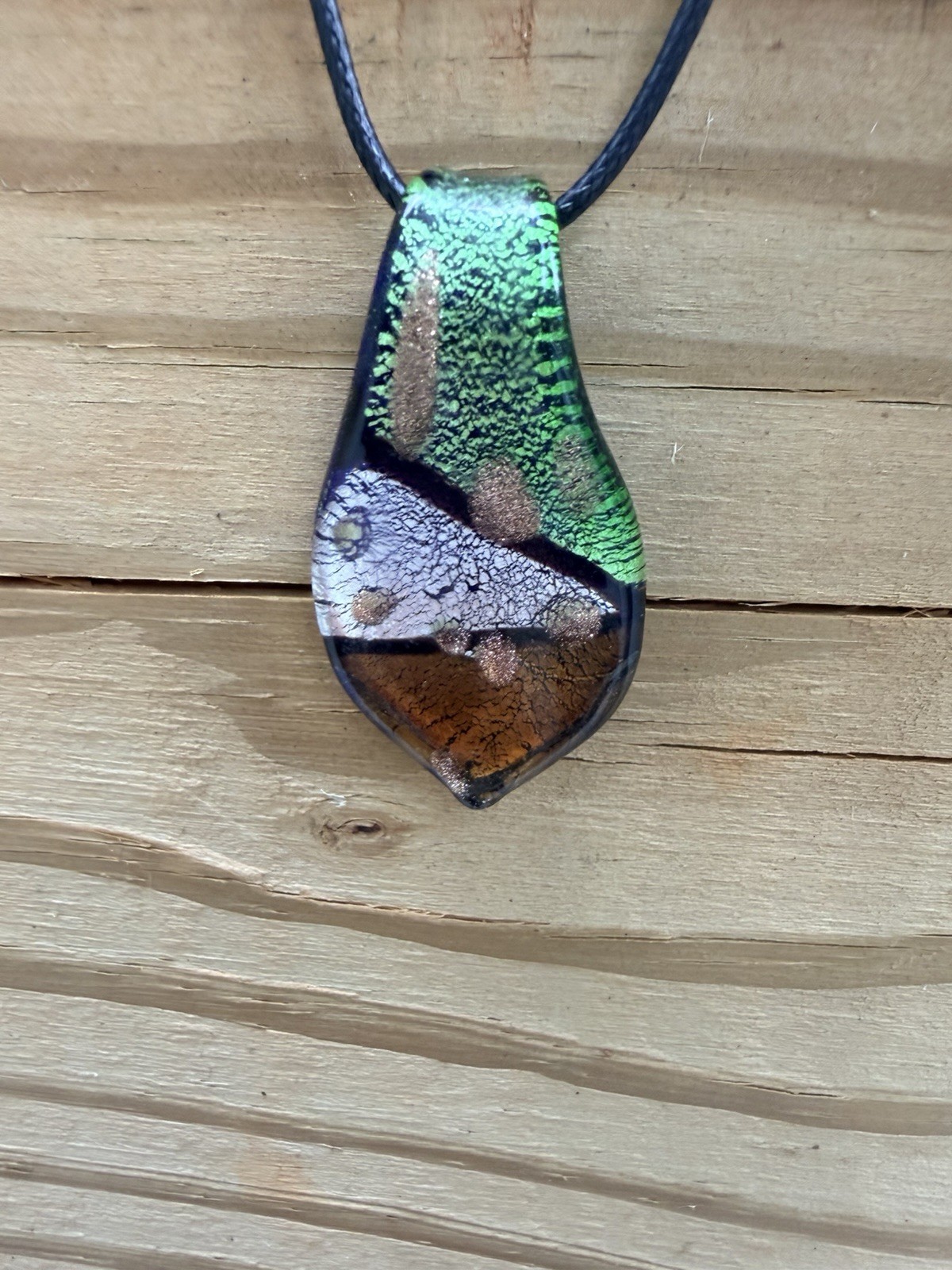 Dichromatic Glass Earth Tone Metallic Leaf Pendant on Black Cord Necklace