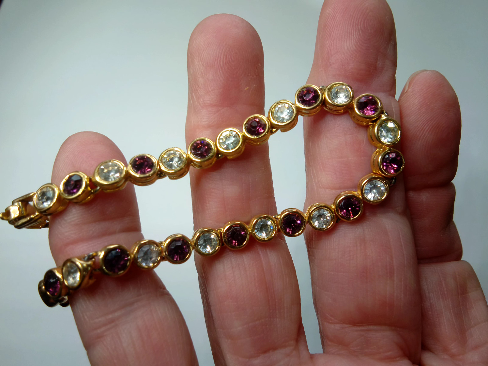 Gold Tone Tennis Bracelet with Alternating Clear and Purple Rhinestoness