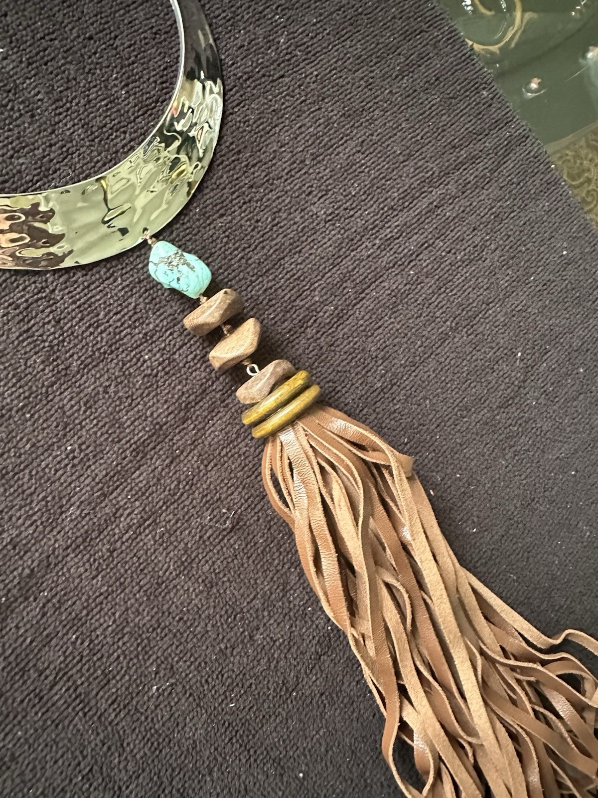 Chico’s boutique necklace; turquoise stone, metal with leather fringes;