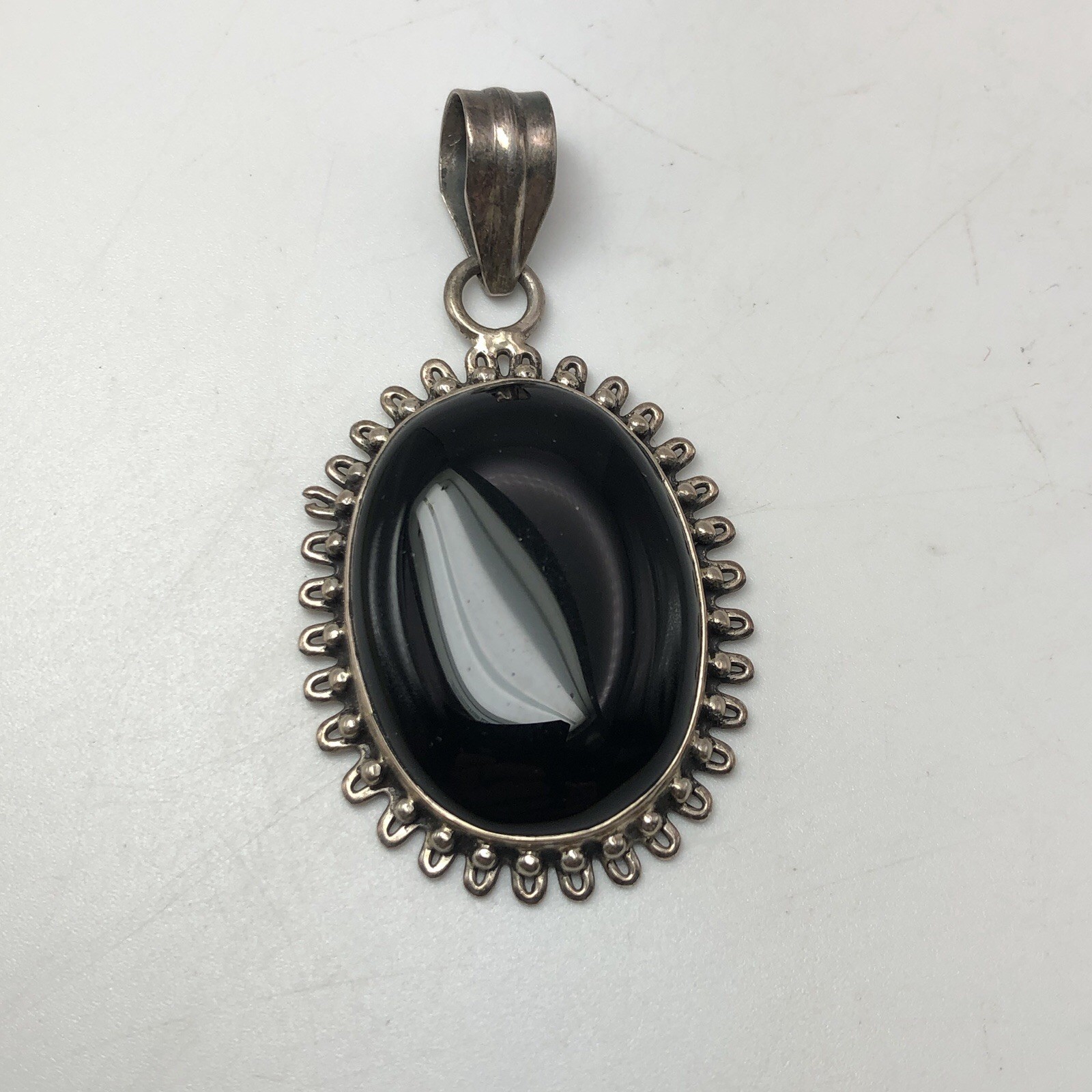 Black Onxy Oval Cabochon Pendant Bezel Set In Sterling Silver