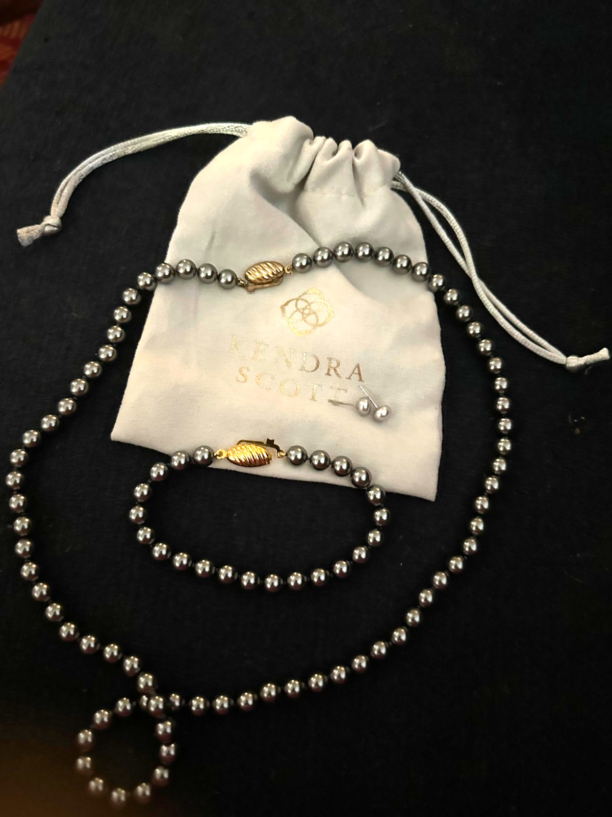 Kendra Scott’s classic gray pearl jewelry set..necklace, bracelet, earrings