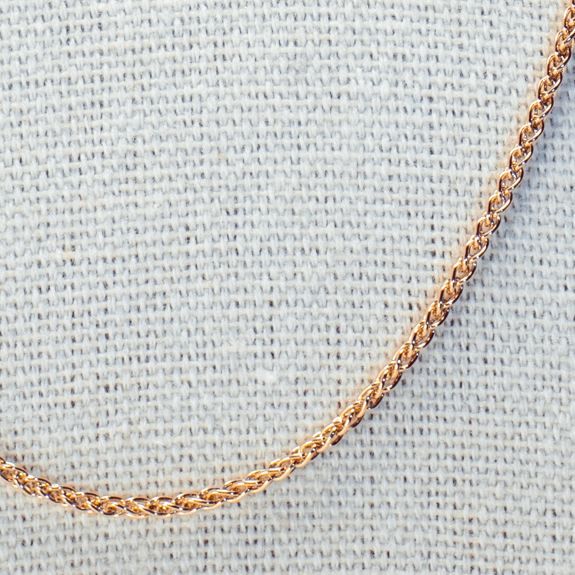 Finely braided silver necklace with gold-plated rose gold