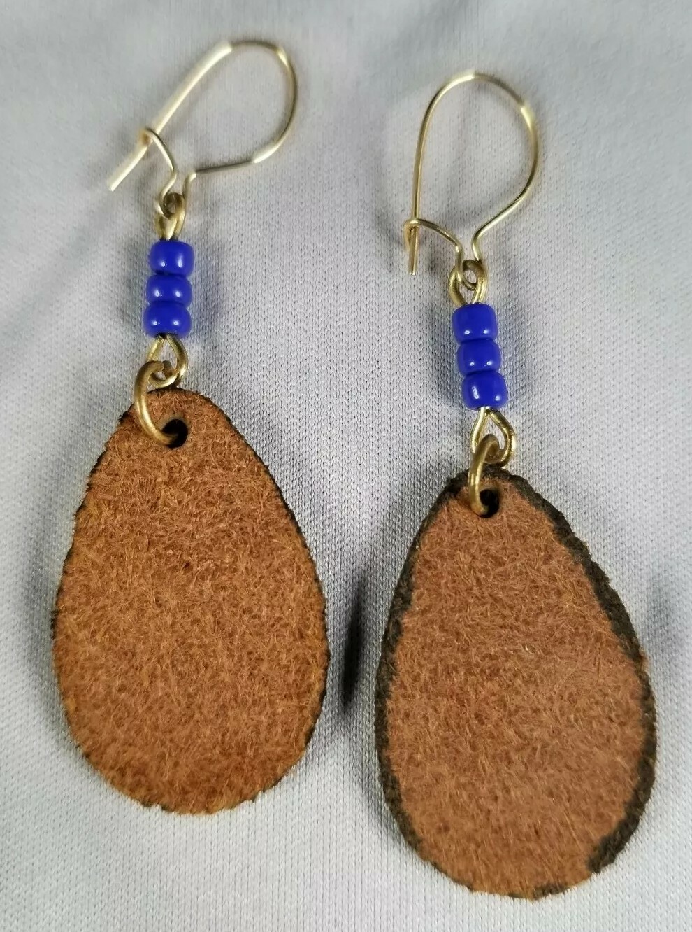 Beautiful light pressed leather butterfly pierced earrings