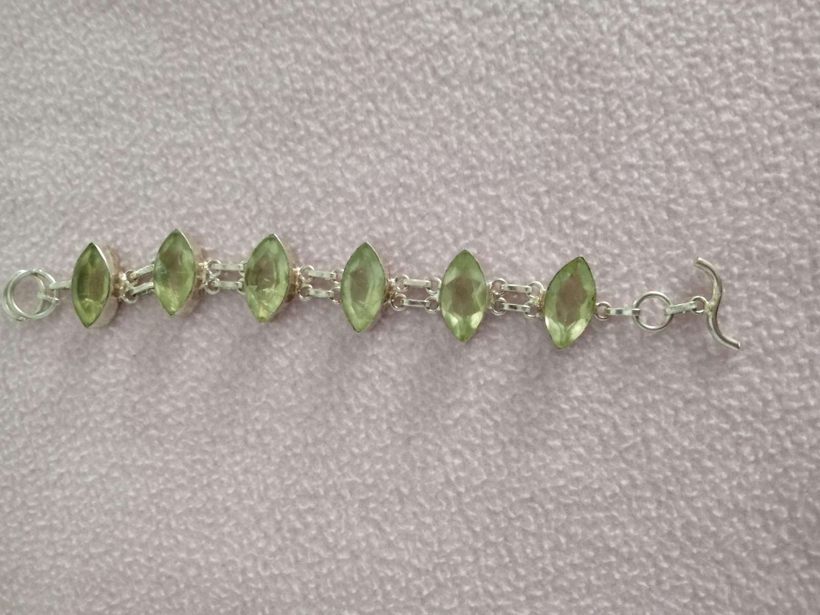 7 inch Bracelet with 5 faceted pale green stones set in silver