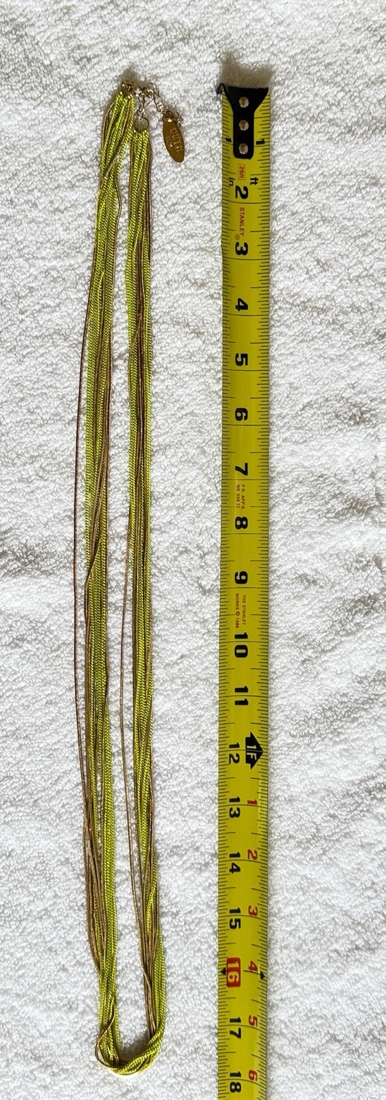 Gold Green Multi Chain Necklace by Cara NY. Lobster Claw Clasp 35”.