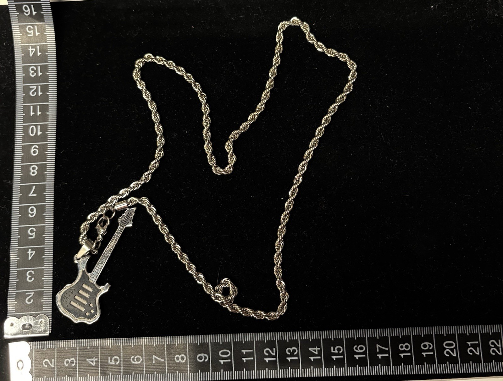 stainless steel guitar pendant necklace features electric guitar silhouette