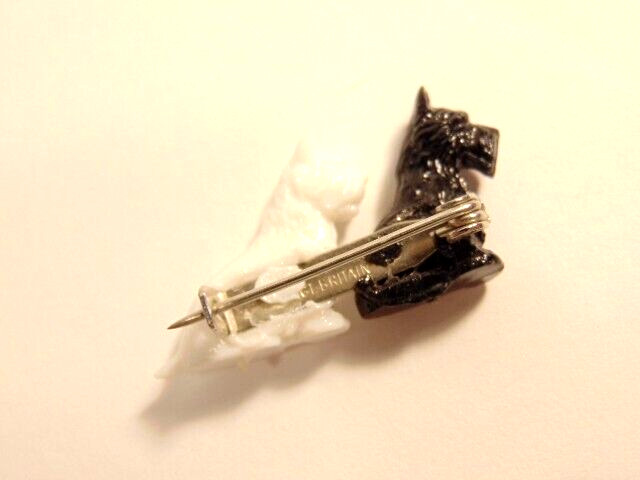 small plastic pin with black & white Terrier type dogs; Made in Great Britain