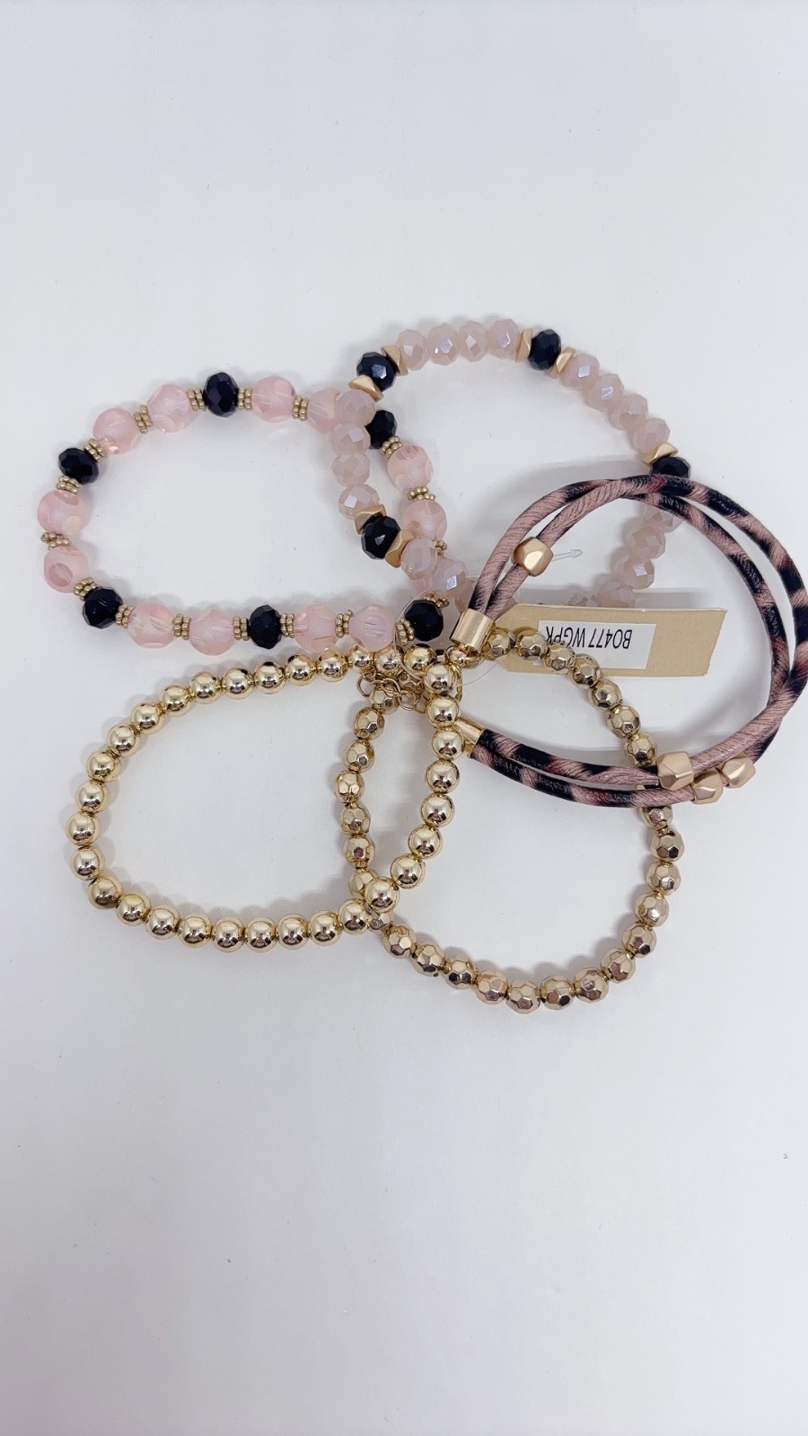 5 Piece Black, Pink, and Gold Bracelets with different Carves and Designs