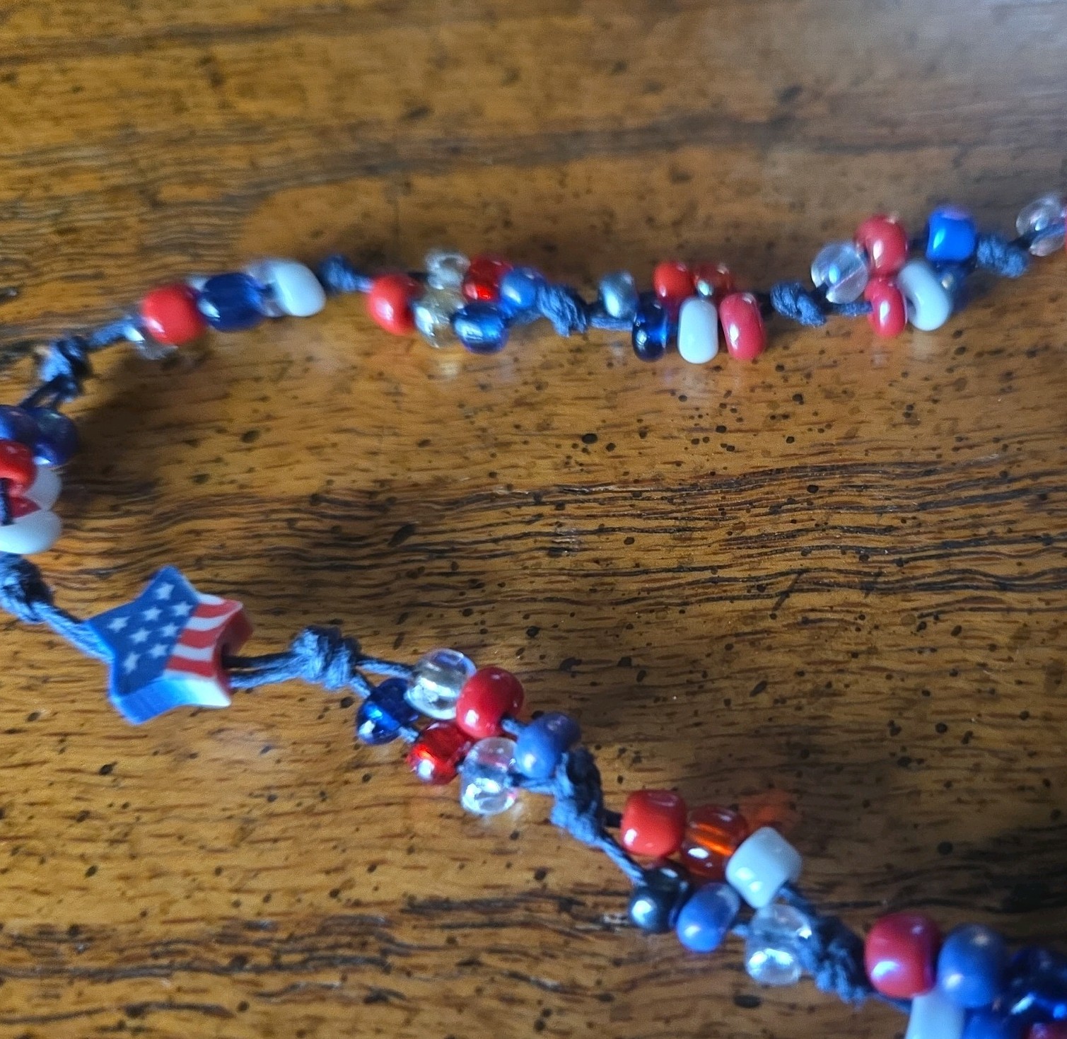 Patriotic red white & blue 8 inch bracelet. Size is adjustable one star bead